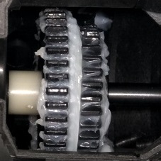 Apply Silicone Grease around the gears to protect the gears and shafts.